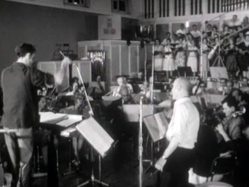 En 1964, Jack Rollan dirige une cantate pour l'Expo nationale.