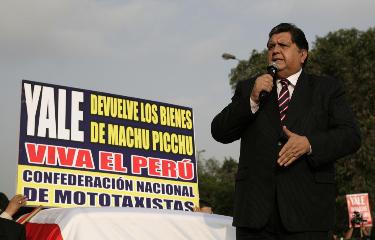 Peru's President Alan Garcia makes a speech during a march to demand Yale University return archeological treasures taken from Machu Picchu in the early 1900s., in Lima, November 5, 2010. Peru says Yale has some 40,000 of artifacts including pottery, jewelry and bones from the Incan site in the Peruvian Andes. The artifacts were sent out of Peru after a Yale alumnus, U.S. explorer Hiram Bingham, rediscovered Machu Picchu in 1911. Yale has shown a willingness to return the pieces as long as Peru can ensure they are cared for properly. The signs reads: 'Yale return the archeological treasures from Machu picchu, long live Peru. [REUTERS - Mariana Bazo]