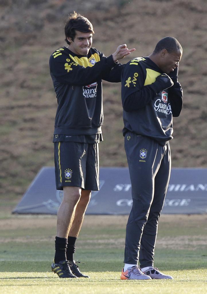 Kaka et Baptista ont l'air de bien rigoler à l'heure de l'entraînement. [KEYSTONE - Andre Penner]