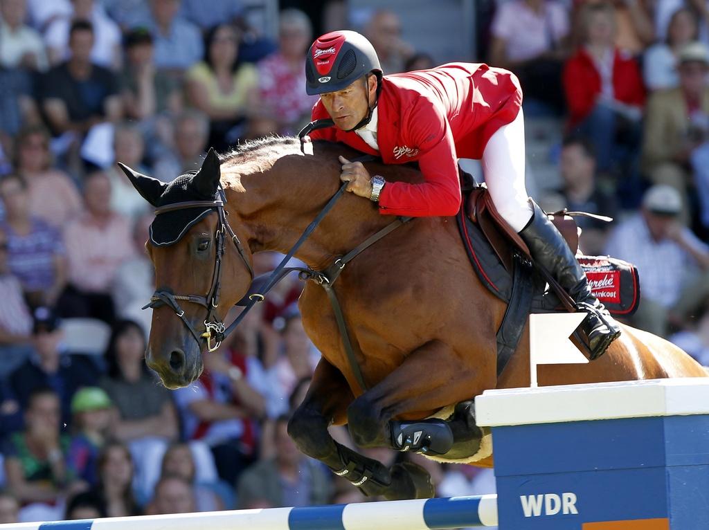 Pius Schwizer vise deux podiums lors de ces Jeux équestres. [KEYSTONE - Hermann J. Knippertz]