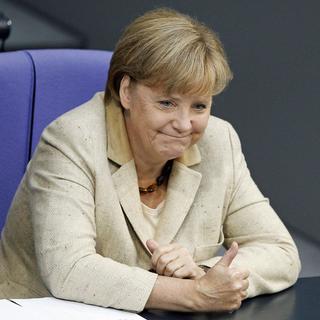 La chancelière allemande Angela Merkel a rallié  ses troupes derrière elle, malgré des voix rebelles. [Tobias Schwarz]