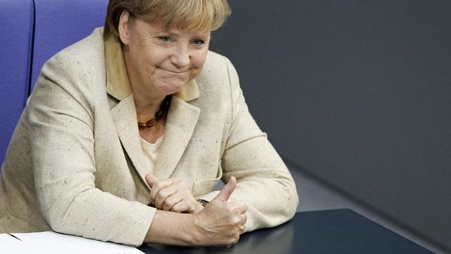 La chancelière allemande Angela Merkel a rallié  ses troupes derrière elle, malgré des voix rebelles. [Tobias Schwarz]