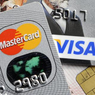 Plusieurs centaines de cartes de crédit d'entreprises suisses sont concernées par de piratage. [AP - Martin Meissner]