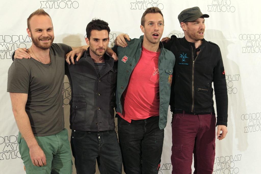 Les membres de Coldplay, W.Champion, G.Berryman, C.Martin et J.Buckland présentaient Mylo Xyloto mercredi à Madrid. [KEYSTONE - Sergio Barrenechea]