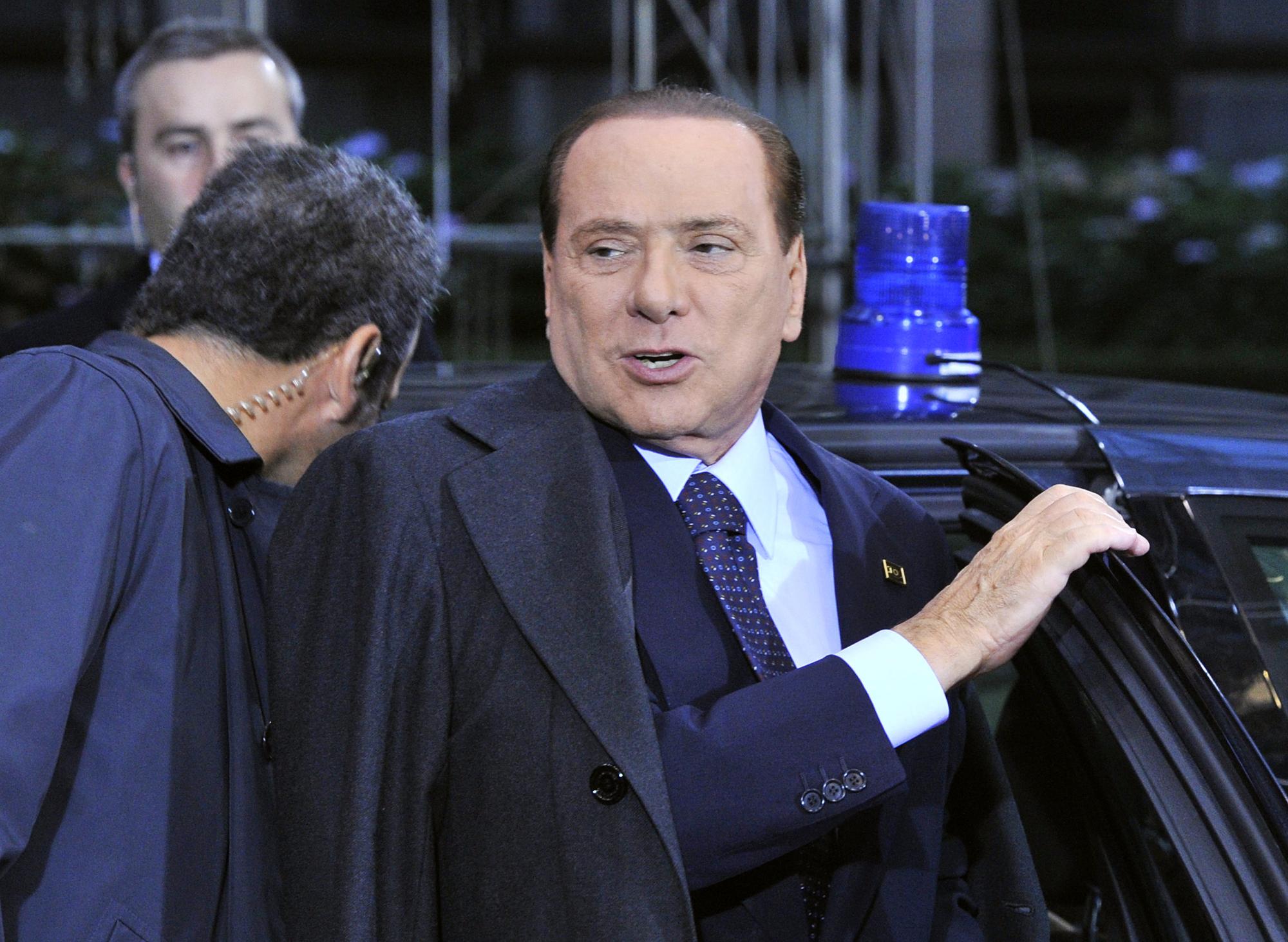 Silvio Berlusconi s'est fait rappeler à l'ordre dimanche par ses partenaires, qui ont exigé de lui des engagements. [AFP - Georges Gobet]