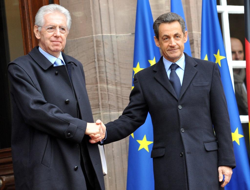 Mario Monti, Nicolas Sarkozy et Angela Merkel ont participé à un sommet tripartite à Strasbourg pour évoquer la crise de la dette européenne. [Michael Probst]