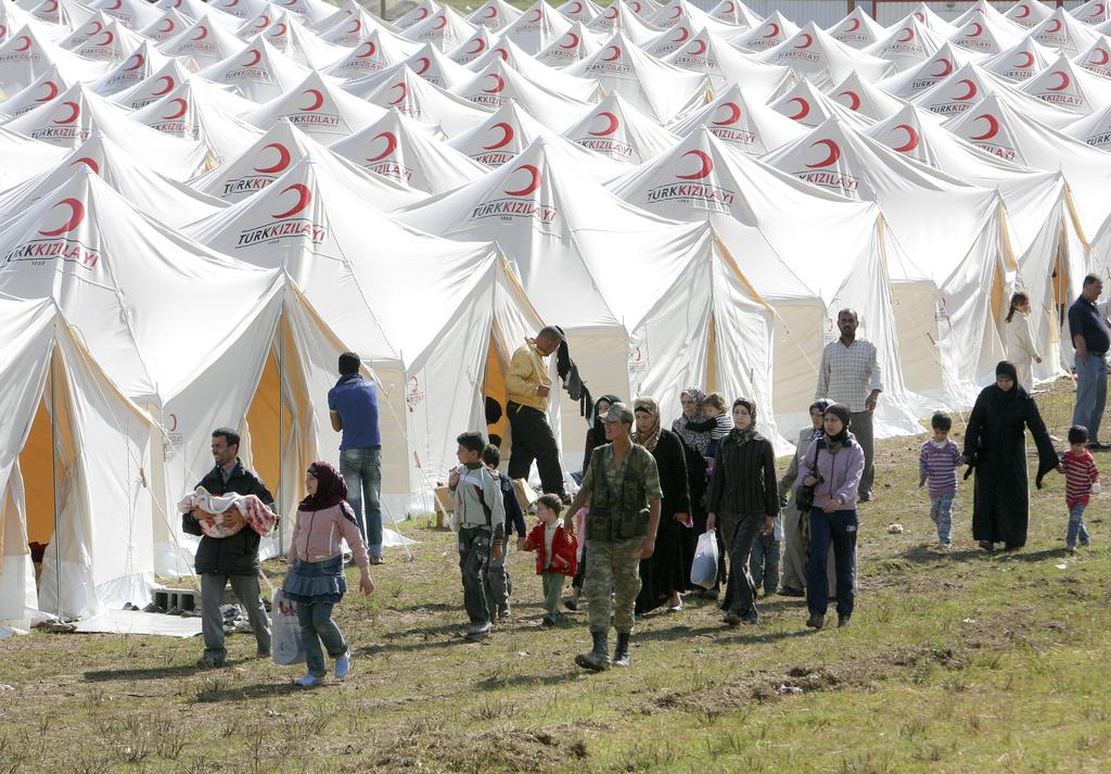 Les réfugiés syriens affluent en Turquie, où 8500 personnes ont déjà été accueillies. [AP Photo/Selcan Hacaoglu]