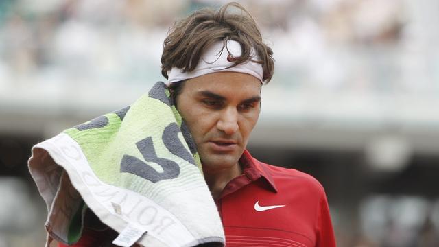 Federer, qui a pourtant livré une de ses plus belles quinzaines à Roland Garros, a échoué pour la quatrième fois face au Majorquin en finale. [KEYSTONE - Guillaume Horcajuelo]