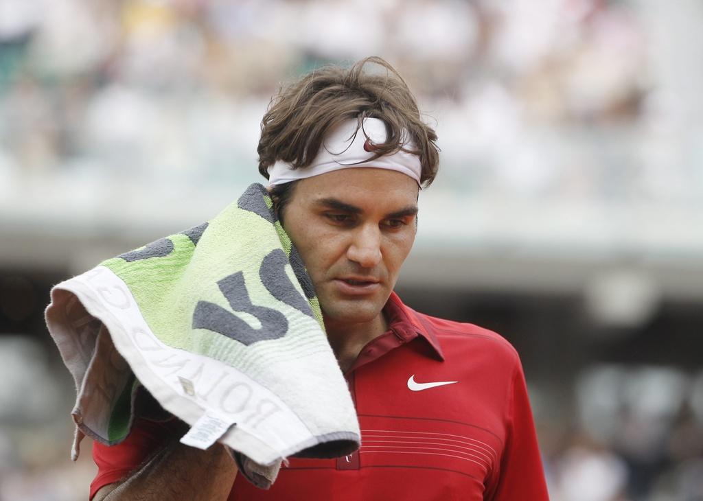 Federer, qui a pourtant livré une de ses plus belles quinzaines à Roland Garros, a échoué pour la quatrième fois face au Majorquin en finale. [KEYSTONE - Guillaume Horcajuelo]