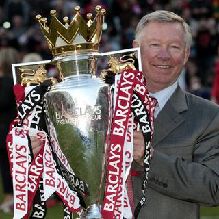 Des titres, Sir Alex Ferguson en a gagné un paquet avec Manchester United. Et il aimerait bien encore garnir sa collection. [Keystone - Jon Super]