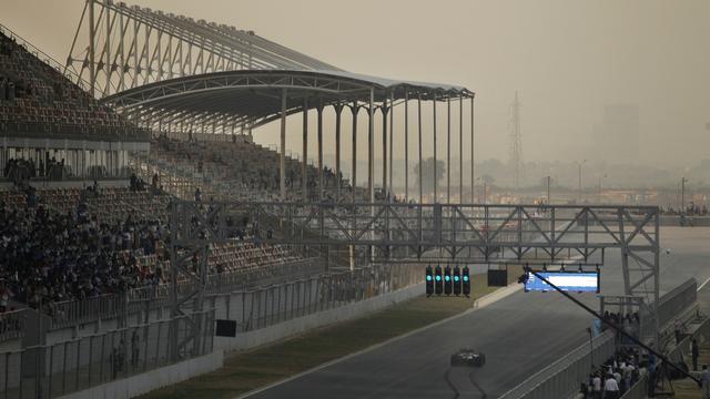 A Red Bull car is driven in the track during the unveiling of the Buddh International Circuit, the venue for India's first Formula One Grand Prix in Noida, 38 kilometers (24 miles) from New Delhi, India, Tuesday, Oct. 18, 2011. The inaugural run is scheduled for Oct. 30. (AP Photo/Saurabh Das) [Saurabh Das]