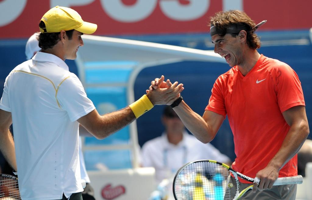 Roger et Rafa se retrouvent souvent sur les courts pour des matches de charité (ici à Melbourne). [KEYSTONE - Dan Peled]