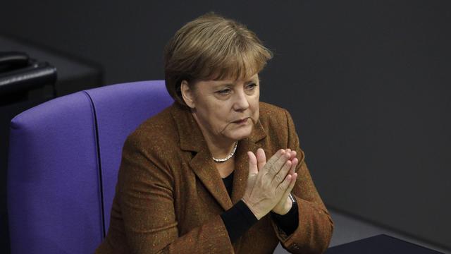 Angela Merkel déclare s'attendre à une année 2012 "plus difficile que 2011". [Keystone - Markus Schreiber]
