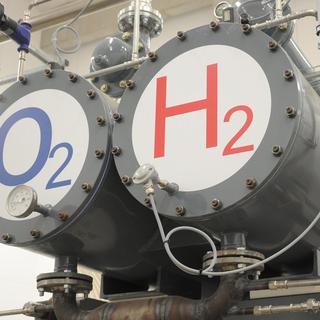 Two tanks marked with 'O2' for oxygene and 'H2' for hydrogene, part of the electrolysis installations, are seen at the first Hydrogene hybrid power plant that was inaugurated in Wittenhofe, near Prenzlau, Germany, on 25 October 2011. Powered by natural sources such as wind energy and bio gas the plant produces electricity and heat while an elektrolyzer uses exess energy to devide water into hydrogene and oxygene for storage. The stored hydrogene, in combination with bio gas can be burnt and re-converted into electrcity in case that the wind turbines are not producing enough energy. EPA/BERND SETTNIK [Brnd Settnik]