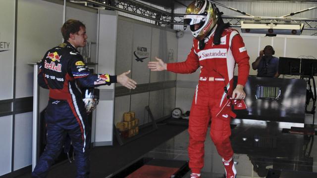 Vettel (à gauche) et Alonso ont signé les meilleurs temps de la journée. [Luca Bruno]