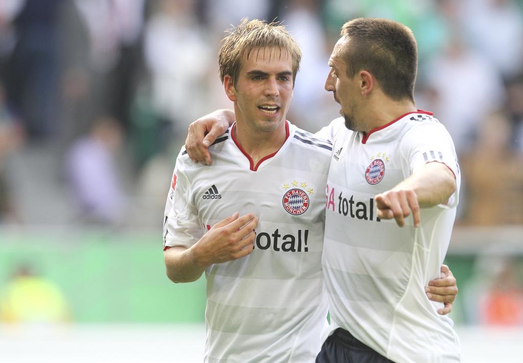 Philipp Lahm et Franck Ribéry aimeraient disputer la finale de la Champions League dans leur stade. [Keystone - Joerg Sarbach]