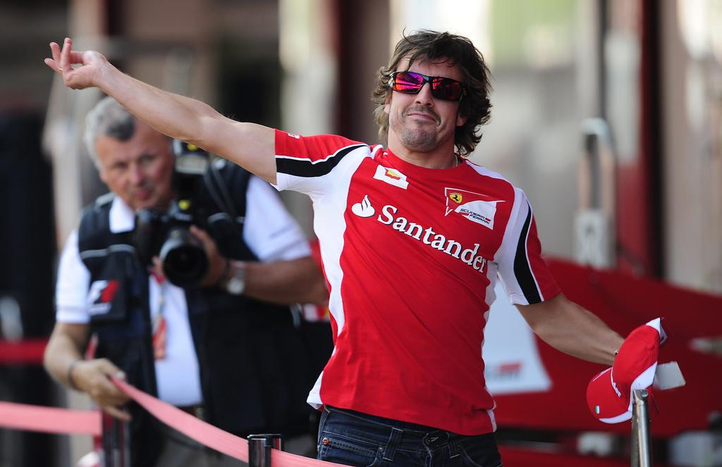 Alonso aborde "son" Grand Prix avec le sourire après avoir prolongé son contrat avec Ferrari. [KEYSTONE - Manu Fernandez]