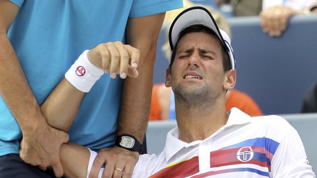 "J'ai huit jours pour récupérer avant l'US Open. Je pense que ça me suffira pour être prêt", a indiqué Djokovic. [Kareem Elgazzar]