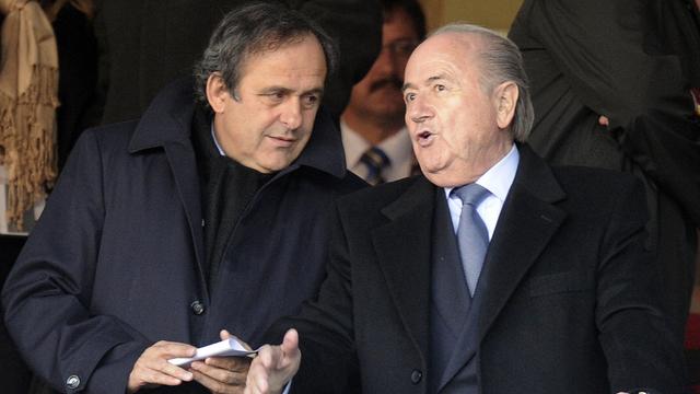 Michel Platini et Sepp Blatter vont proposer un nouveau calendrier... dès qu'ils seront réélus! [Keystone - Martin Meissner]