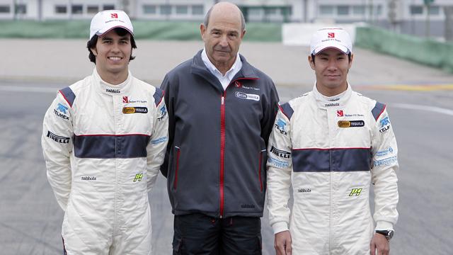 BMW Sauber Formula One team Principal Peter Sauber, center, and Sauber Formula One drivers Kamui Kobayashi of Japan, right, and Sergio Perez of Mexico, left, pose in front of the team's new F1 car during the team's official launch at the Ricardo Tormo race track in Cheste, Valencia [Alberto Saiz]