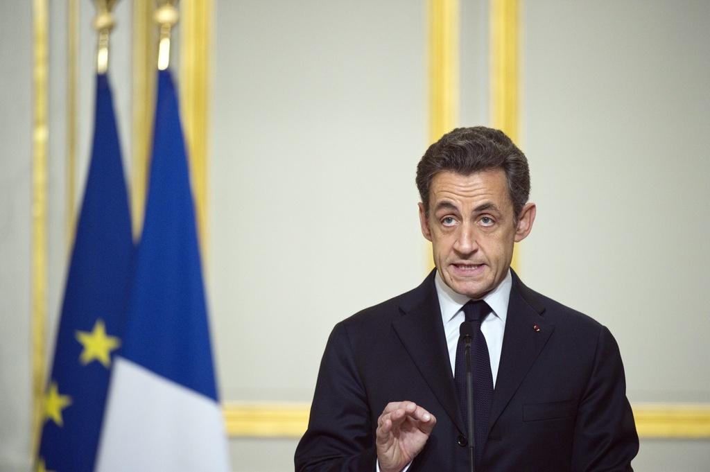 Nicolas Sarkozy a annoncé le début des frappes après une réunion extraordinaire à Paris. [KEYSTONE - EPA/LIONEL BONAVENTURE]