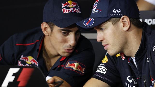 Red Bull driver Sebastian Vettel of Germany, right, and Toro Rosso driver Sebastien Buemi of Switzerland, left, speak during the press conference on the Marina Bay City Circuit at the Singapore Formula One Grand Prix in Singapore, Thursday, Sept. 22, 2011. (AP Photo/Eugene Hoshiko) [KEYSTONE - Eugene Hoshiko]