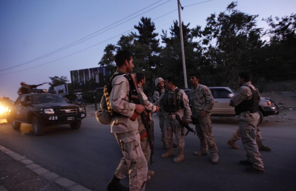 Les forces de sécurité afghanes se sont déployées en masse. [AP Photo/Gemunu Amarasinghe]