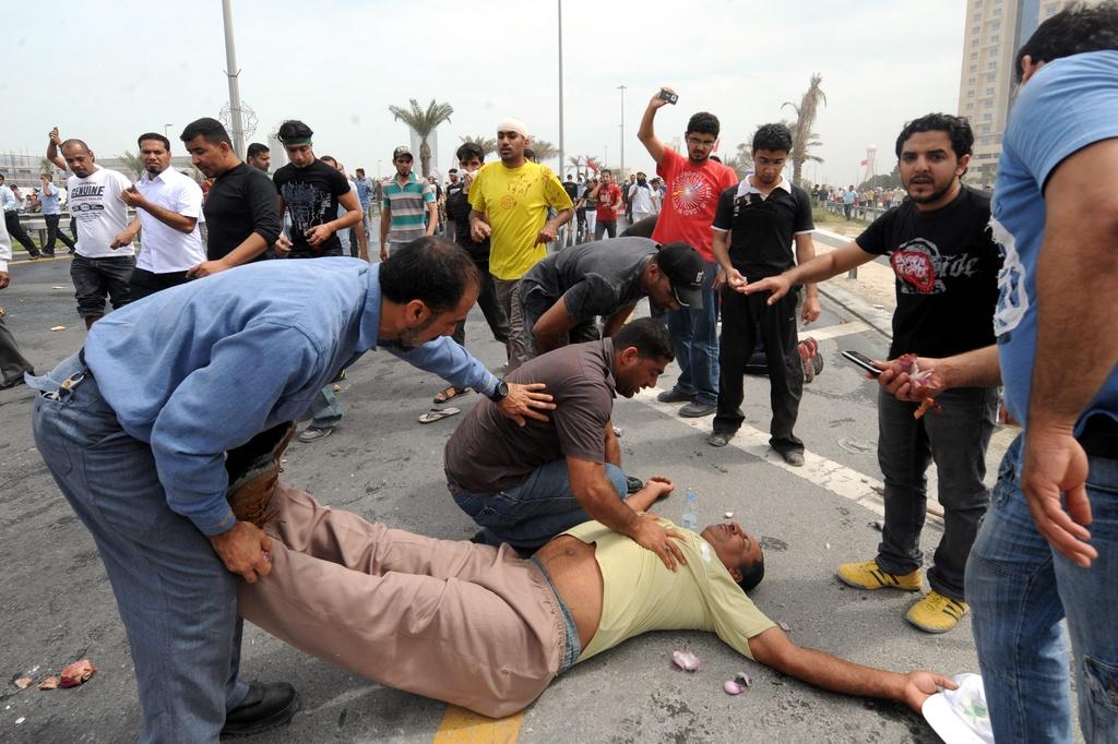Les manifestants à Manama tentaient de bloquer l'accès au district financier. [KEYSTONE - Mazen Mahdi]