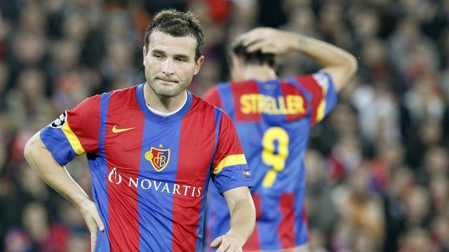 Basel's Alex Frei, left, and Marco Streller, right, react during the Champions League group stage, group C, soccer match between Switzerland's FC Basel and Portugal's Benfica Lisbon, at the St. Jakob-Park stadium in Basel, Switzerland, Tuesday, October 18, 2011. (KEYSTONE/Alessandro Della Bella) [KEYSTONE - Alessandro Della Bella]