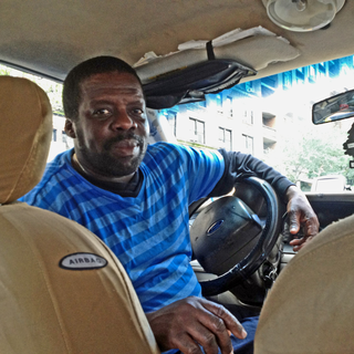 Charles, 54 ans, chauffeur de taxi haïtien. [Maurine Mercier]