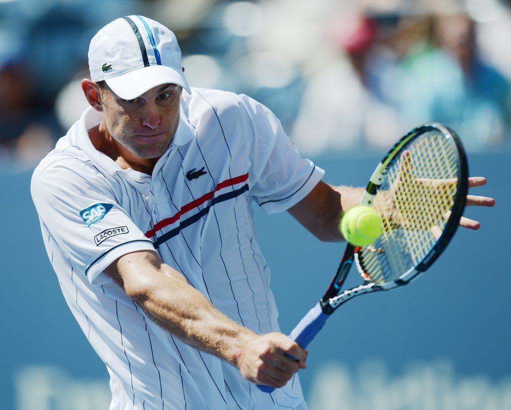 epa03372734 Andy Roddick of the US hits a return to Rhyne Williams of the US during their match on the second day of the 2012 US Open Tennis Championship at the USTA National Tennis Center in Flushing Meadows, New York, USA, 28 August 2012. The US Open runs through Sunday 09 September 2012. EPA/JASON SZENES [KEYSTONE - Jason Szenes]