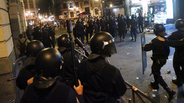 La police espagnole face aux manifestants jeudi soir à Madrid. [Andres Kudacki]