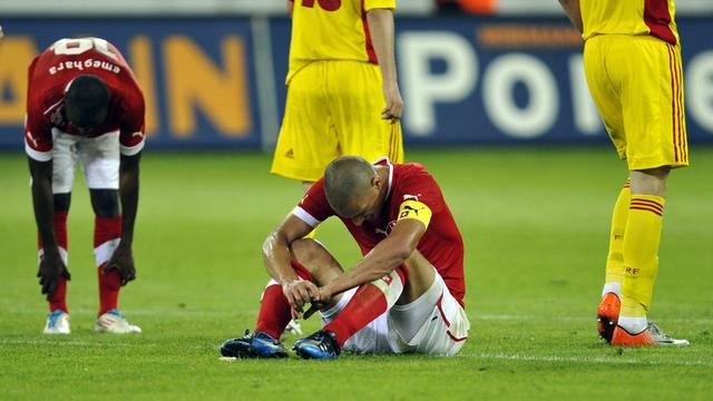 Switzerland's Innocent Emeghara, left, and Goekhan Inler, right, react after loosing the international friendly test game between the national soccer teams of Switzerland and Romania at the Swisspoarena stadium in Lucerne, Switzerland, Wednesday, May 30, 2012. (KEYSTONE/Sigi Tischler).... [Sigi Tischler]