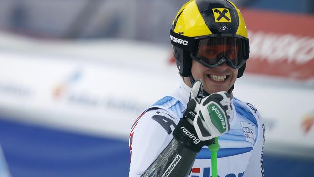 Marcel Hirscher of Austria celebrates after winning the first place at the men's alpine skiing World Cup giant slalom race at the Bulgarian ski resort of Bansko, some 150 km (93 miles) south of Sofia February 18, 2012. REUTERS/Stoyan Nenov (BULGARIA - Tags: SPORT SKIING) [Stoyan Nenov]