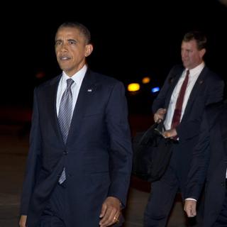 Barack Obama a répondu à Mitt Romney qui l'accuse de ne pas suffisamment défendre les vauleurs américaines. [Carolyn Kaster]