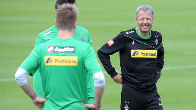 Lucien Favre a le sourire. Il a prolongé son bail au Borussia Park jusqu'en 2015. [Keystone - FEDERICO GAMBARINI]