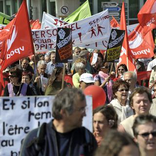 Près de 2000 personnes ont pris part au cortège du 1er mai à Genève. [Martial Trezzini]