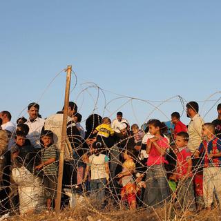 Des réfugiés syriens à la frontière turque.