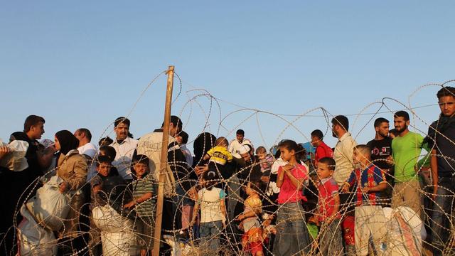 Des réfugiés syriens à la frontière turque.