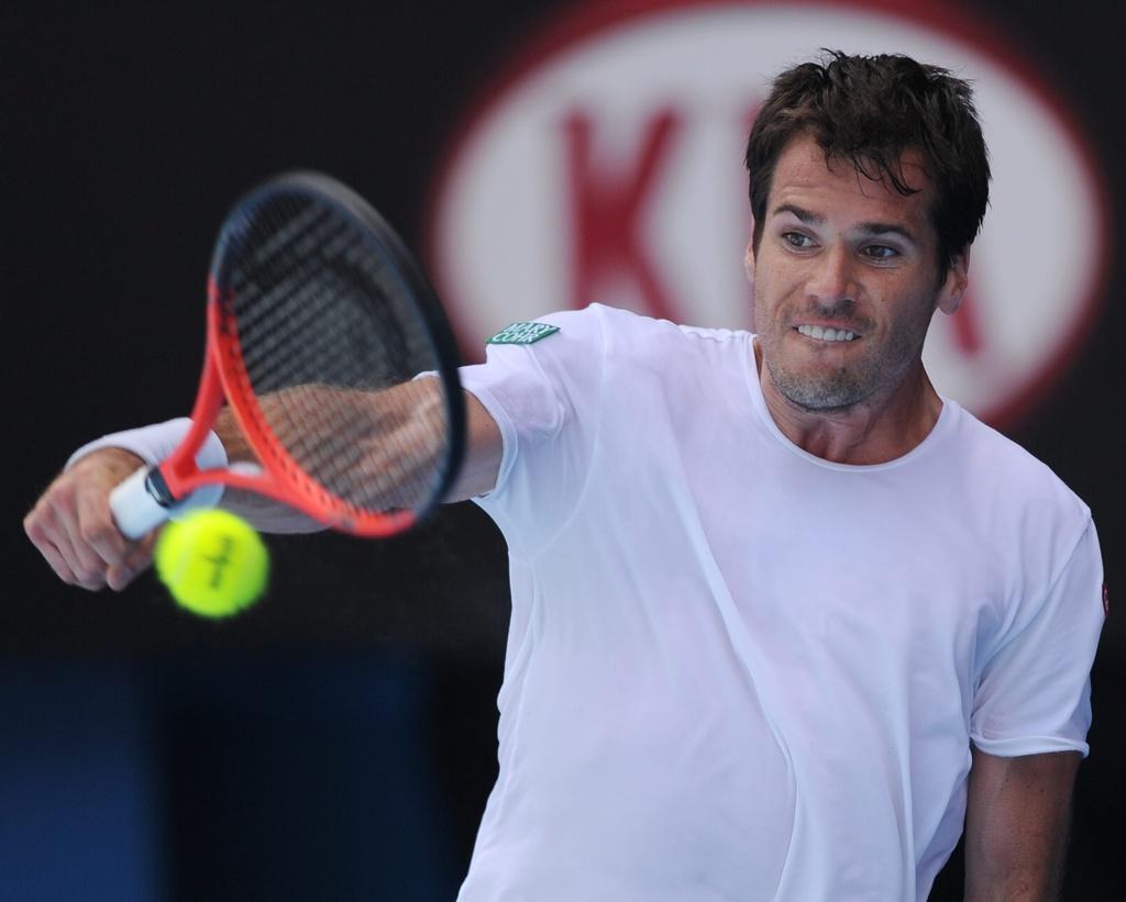 Germany's Tommy Haas makes a backhand return to Spain's Rafael Nadal during their second round match at the Australian Open tennis championship, in Melbourne, Australia, Wednesday, Jan. 18, 2012. (AP Photo/Andrew Brownbill) [A.Brownbill]