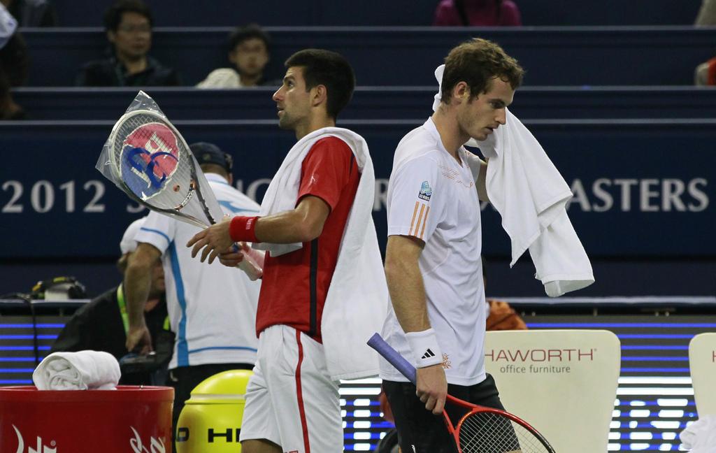 A dos. La rivalité entre Djokovic et Murray a pris du volume en 2012. Les deux compères ont cependant croisé leurs raquettes pour la première fois lorsqu'ils avaient 11 ans. [KEYSTONE - Eugene Hoshiko]