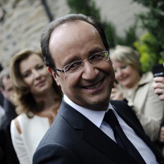 FRANCE, Tulle : Socialist Party (PS) candidate for the 2012 French presidential election, Francois Hollande smiles during a visit in a village in the neighbourhoods of Tulle, southwestern France on May 6 during the second round of the election. AFP PHOTO FRED DUFOUR [Fred Dufour]