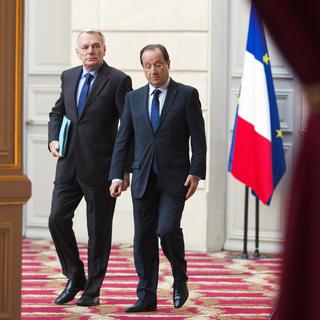François Hollande et Jean-Marc Ayrault sont sous le feu des critiques de la presse. [Joël Saget]