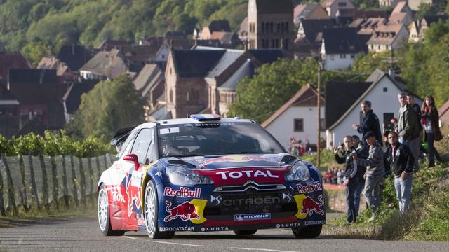 Citroen driver Sebastien Loeb, of France, and his co-driver Daniel Elena, of Monaco, steer their car during the second stage of the Rally de France, in Guberschwihr, eastern France, Friday, Oct. 5, 2012. (AP Photo/Laurent Cipriani) [Laurent Cipriani]