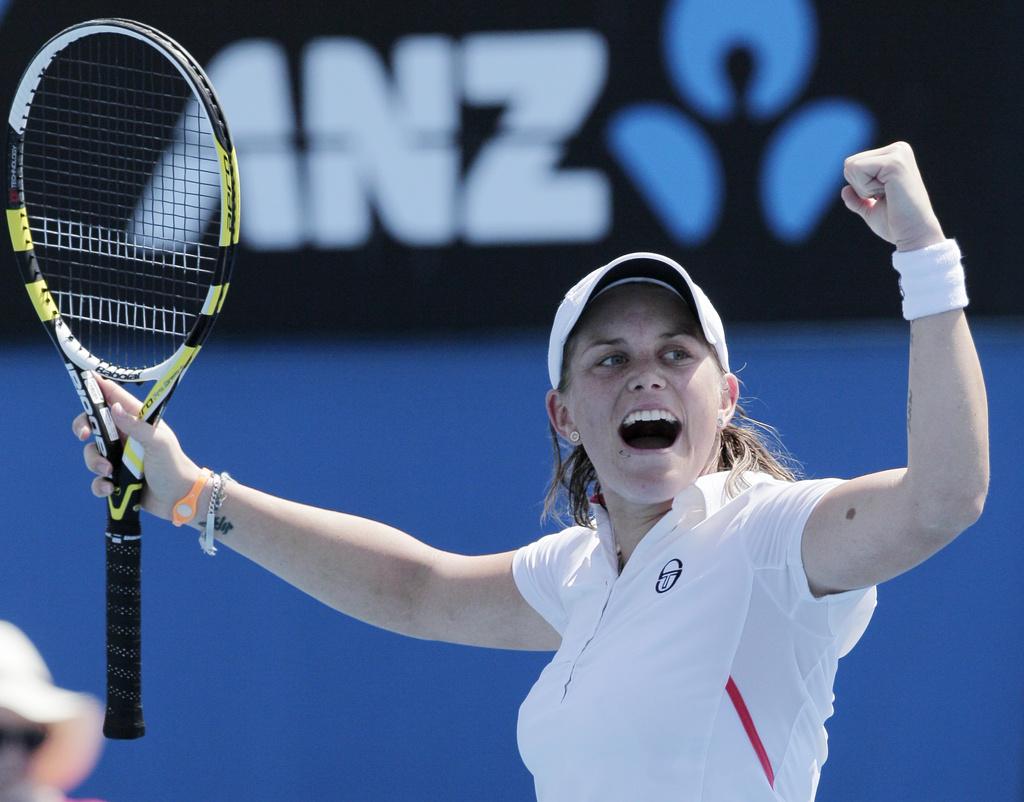 Italy's Romina Oprandi celebrates after defeating compatriot Francesca Schiavone in their second round match at the Australian Open tennis championship, in Melbourne, Australia, Wednesday, Jan. 18, 2012. (AP Photo/John Donegan) [John Donegan]