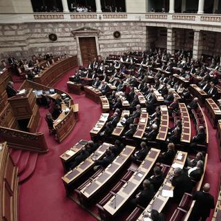 Le Parlement grec a approuvé tard dimanche soir le plan d'austérité voulu par l'UE et le FMI. [AFP]