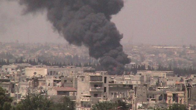 Scène de bombardement d'un quartier de Homs. [Shaam]