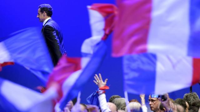 Nicolas Sarkozy (L), French incumbent President and 'Union pour un Mouvement Populaire' (UMP) party candidate for the 2012 French Presidential election, leaves the stage after his declaration to supporters after conceding defeat to Francois Hollande in Paris, France, 06 May 2012. Nicolas Sarkozy conceded defeat to Francois Hollande in 06 May's presidential election. 'Francois Hollande is the president of the republic and he must be respected,' he told supporters in Paris, wishing the Socialist luck. EPA/CHRISTOPHE KARABA [Christophe Karaba]