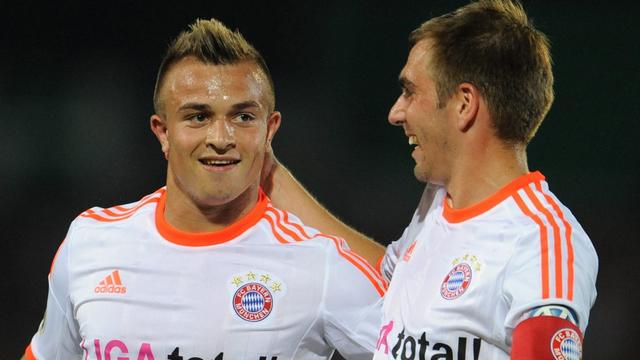 Xherdan Shaqiri (à gauche, ici avec Philipp Lahm) a laissé une bonne impression lors des matches de pré-saison avec sa nouvelle équipe. [KEYSTONE - Andreas Gebert]