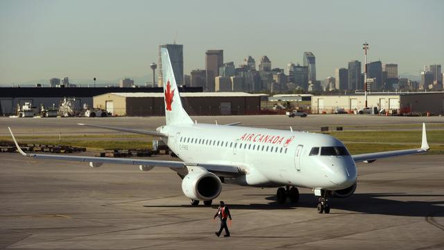 An Air Canada plane gets ready for take off at the International airport in Calgary. [Todd Korol]